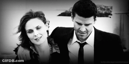 Man In Suit And Woman Standing Together GIF