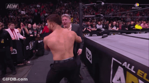 Man In Suit And Wrestler In AEW Ring GIF