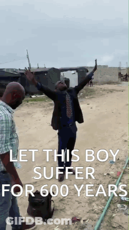 Man In Suit Arms Up Another Man Behind GIF