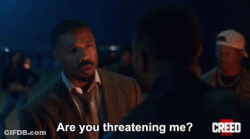 Man In Suit Asking Are You Threatening Me GIF