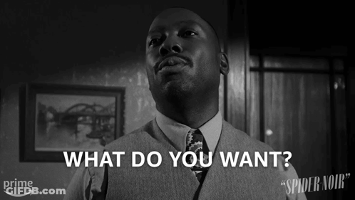 Man In Suit Asking What Do You Want Black White GIF