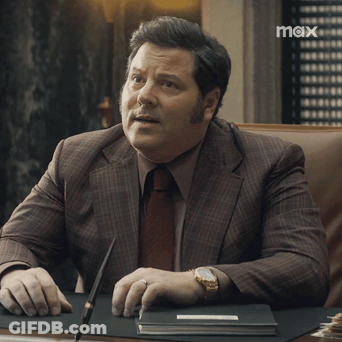 Man In Suit Asking What Does That Mean GIF