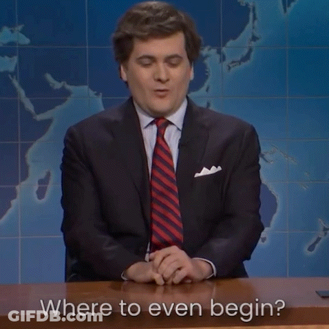Man In Suit Asking Where To Even Begin GIF