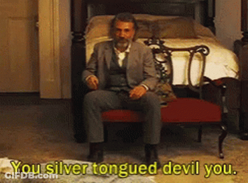 Man In Suit At Bed Saying You Silver Tongued Devil You GIF