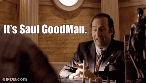 Man In Suit At Desk Saying It's Saul Goodman GIF