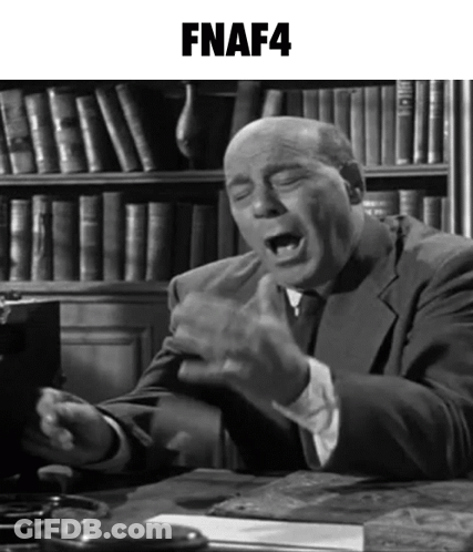Man In Suit At Desk With FNAF4 Bookshelf GIF