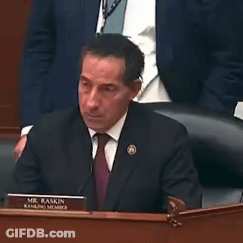 Man In Suit At Desk With Mr. Baskin Name Plate GIF