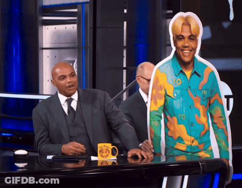 Man In Suit At Desk With NBA Mug GIF
