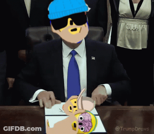 Man In Suit At Desk With Trump Draws Cartoon GIF