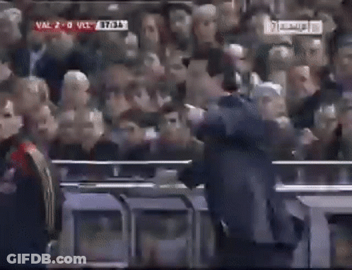 Man In Suit At Football Game GIF