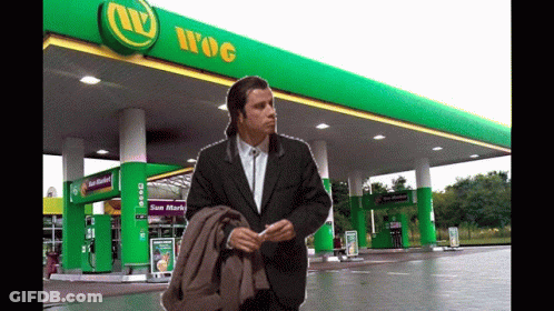 Man In Suit At Gas Station GIF