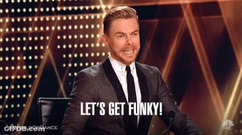 Man In Suit At Microphone: Let's Get Funky GIF