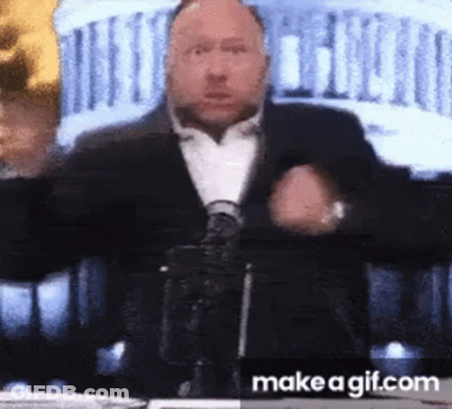 Man In Suit At Microphone GIF