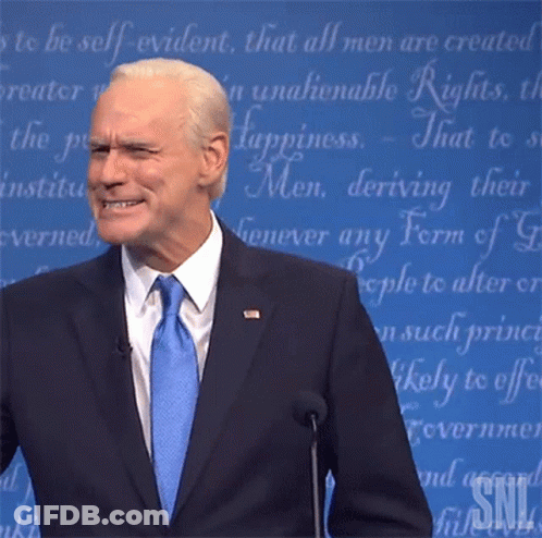 Man In Suit At Microphone With SNL Logo GIF