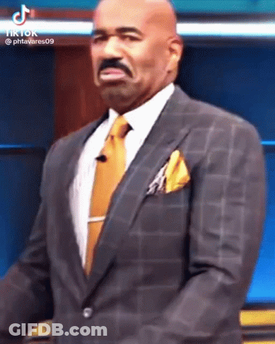 Man In Suit At Microphone GIF