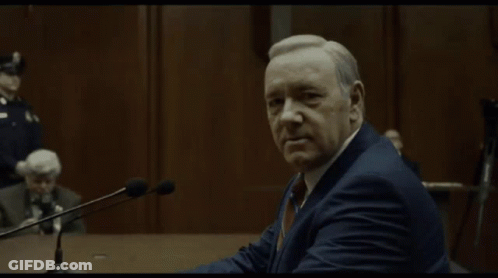 Man In Suit At Microphones Welcome To The Death Of The Age Of Reason GIF