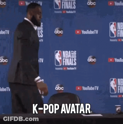 Man In Suit At NBA Finals Sign GIF