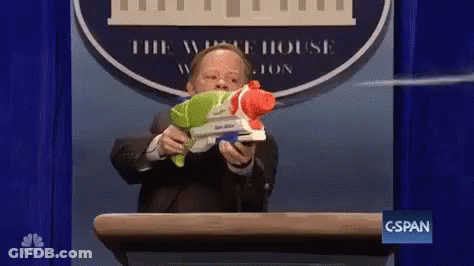 Man In Suit At Podium GIF