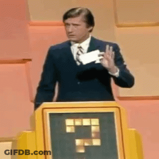 Man In Suit At Podium Holding Paper And Thumbs Up GIF