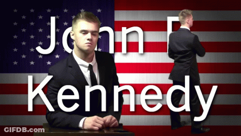 Man In Suit At Podium Saying Alright GIF