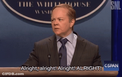 Man In Suit At Podium Saying Alright GIF