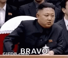 Man In Suit At Podium Saying Bravo GIF