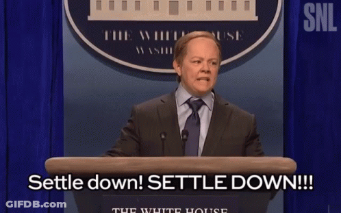 Man In Suit At Podium Saying Settle Down GIF