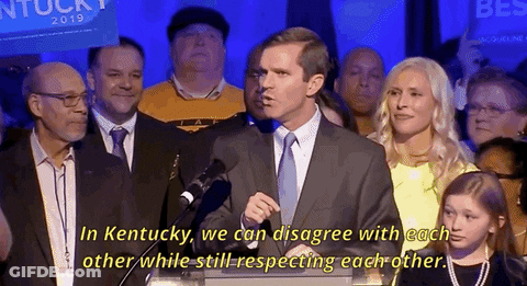 Man In Suit At Podium Says In Kentucky GIF