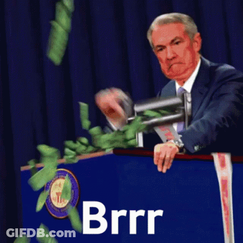 Man In Suit At Podium With Money Falling Brrr GIF
