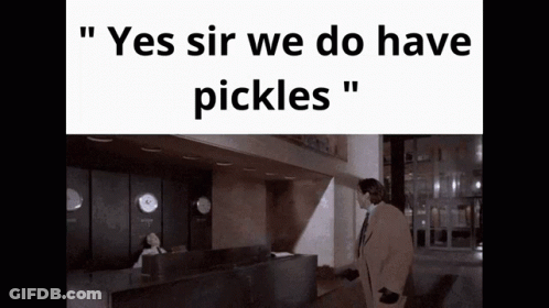 Man In Suit At Reception Desk Saying Yes Sir We Do Have Pickles GIF