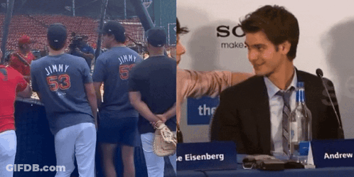 Man In Suit At Table With Sign Saying Andrew Eisenberg GIF