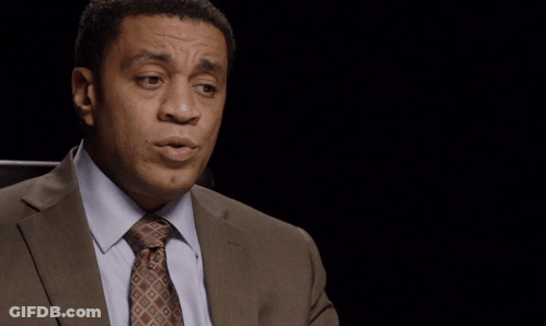 Man In Suit At The Situation Is Uncertain Sign GIF