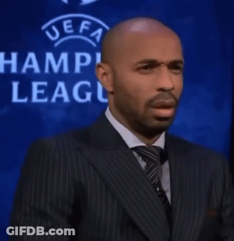 Man In Suit At UEFA Champions League Sign GIF