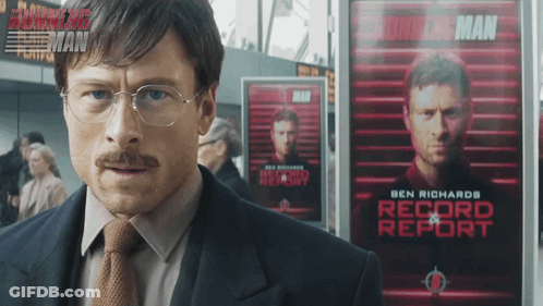 Man In Suit Before Ben Richards Record Report Poster GIF
