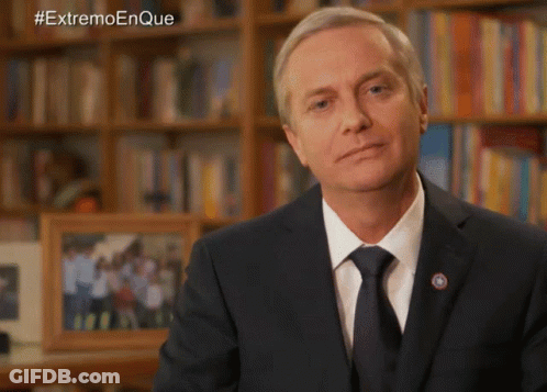 Man In Suit Before Bookshelf Hashtag Extremo Enque GIF