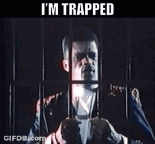 Man In Suit Behind Bars Saying I'm Trapped GIF