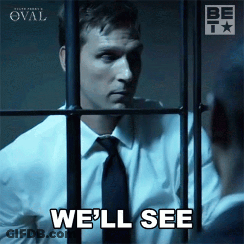 Man In Suit Behind Bars Saying We'll See GIF