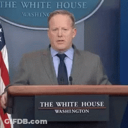 Man In Suit Behind Podium At White House GIF