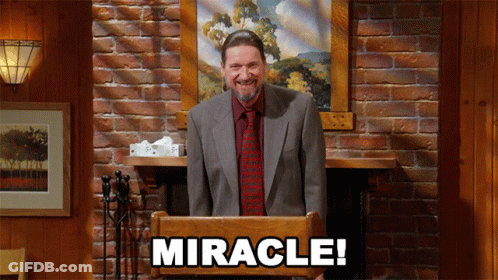 Man In Suit Behind Podium Saying Miracle GIF