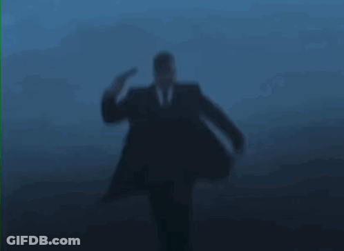 Man In Suit Being Shot In Head GIF