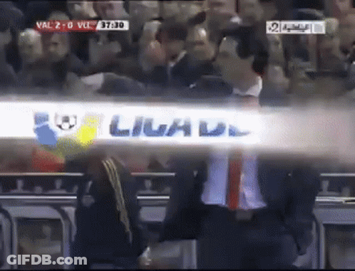 Man In Suit Beside Livad Sign GIF