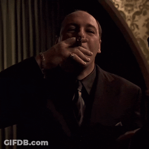 Man In Suit Blowing Kiss GIF