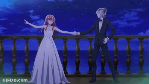 Man In Suit Bow Tie Kissing Red-Haired Woman GIF