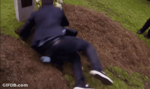 Man In Suit Buried In Dirt GIF