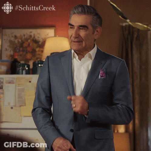 Man In Suit By Refrigerator With Schitts Creek GIF
