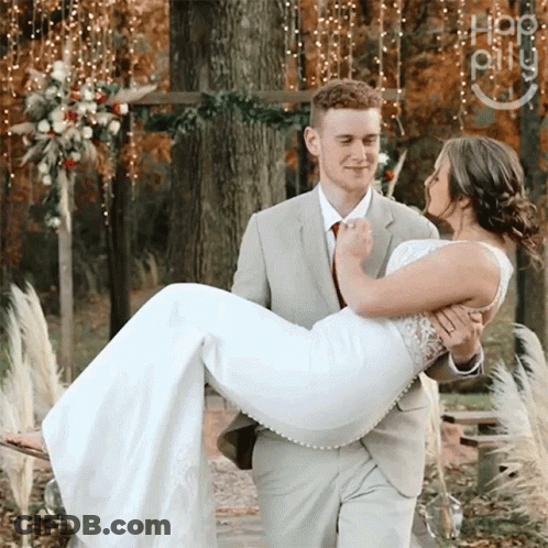Man In Suit Carrying Woman In White Dress GIF