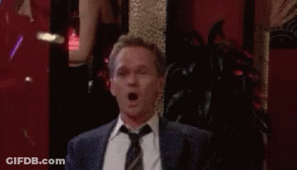Man In Suit Celebrating With Confetti GIF