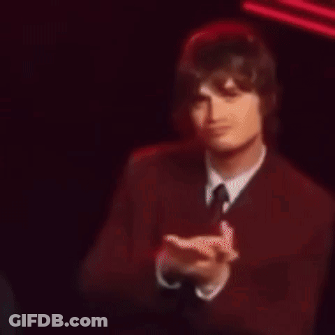Man In Suit Clapping By Building With B GIF