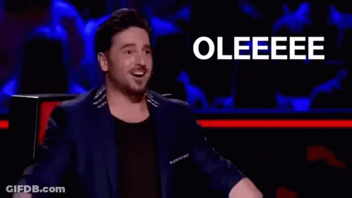 Man In Suit Clapping In Front Of Crowd GIF