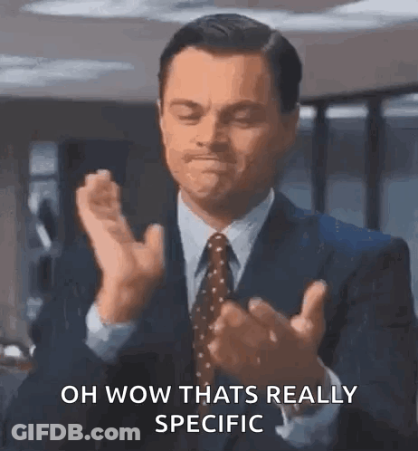 Man In Suit Clapping Saying Oh Wow GIF